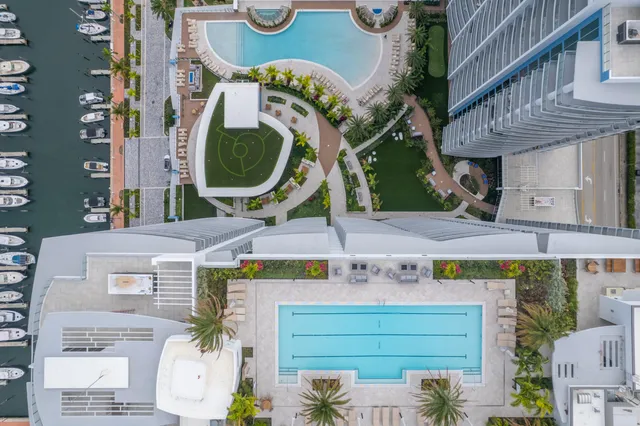 a living room with furniture and floor to ceiling window