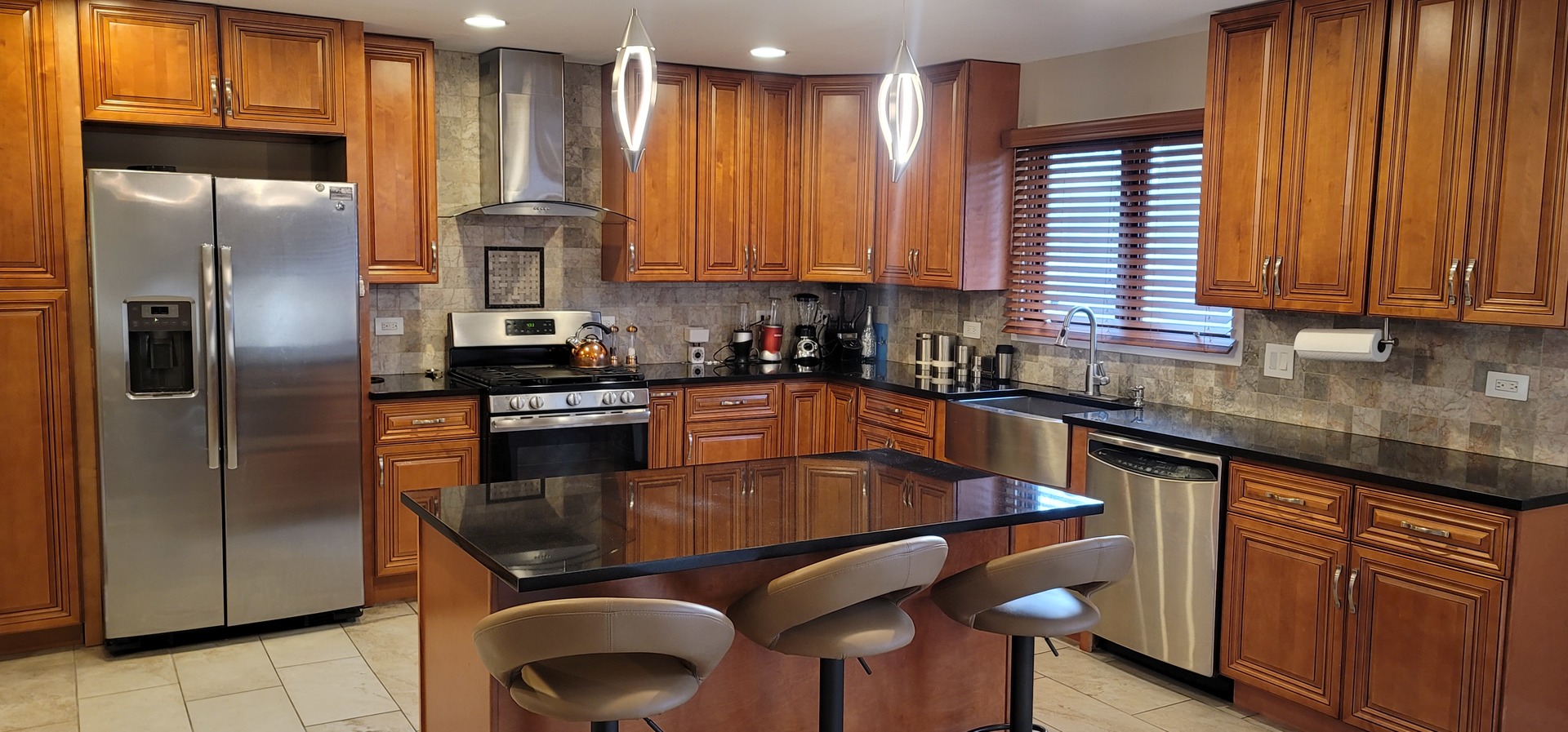 1045 Wingate Road Olympia Fields, IL 60461 - Photo 9 of 28 a kitchen with stainless steel appliances granite countertop a stove a sink and a refrigerator