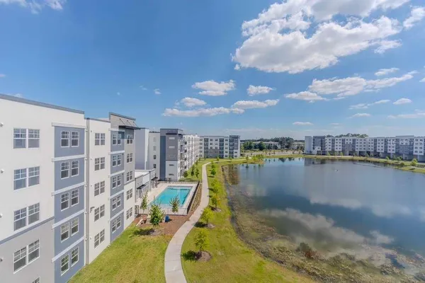 a view of a swimming pool with a lake view