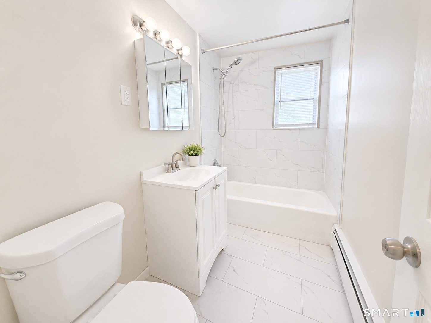 366 Park Road West Hartford, CT 06119 - Photo 6 of 8 a bathroom with a sink toilet and shower
