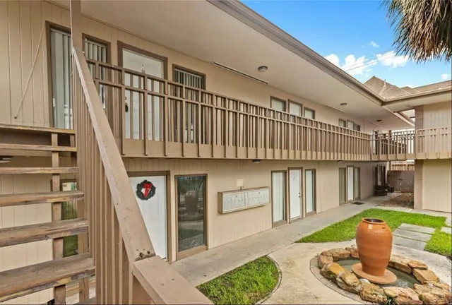 a front view of a house with a sink and table