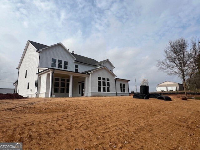 5470 Settingdown Road Cumming, GA 30028 - Photo 17 of 19 a front view of a house with a yard