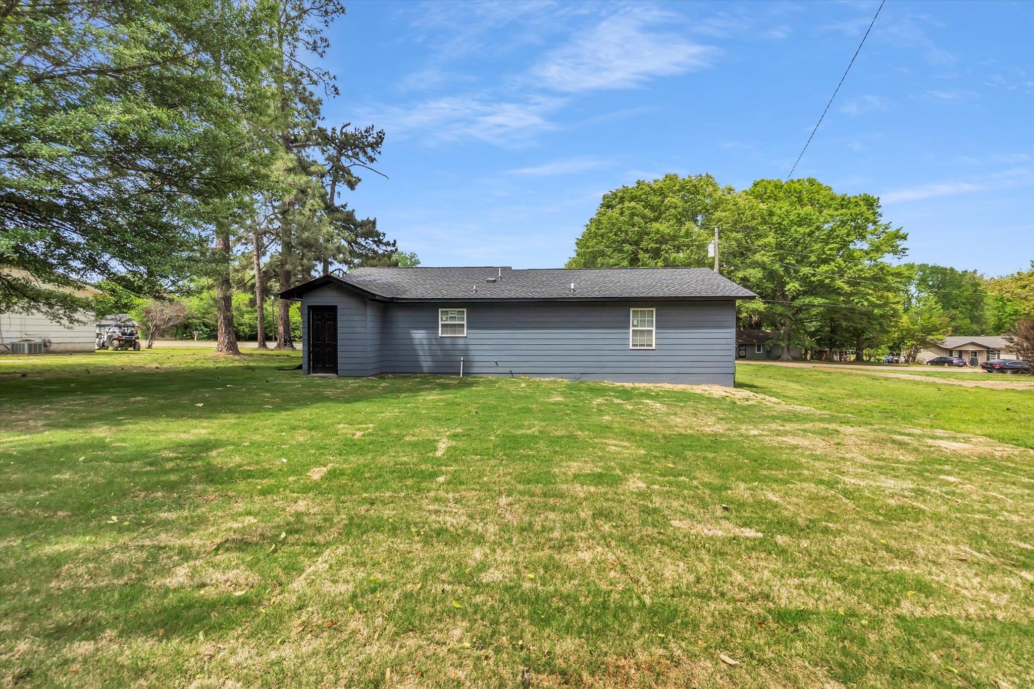 129 Tatlock Circle Covington, TN 38019 - Photo 15 of 16 Rear view of house with a yard
