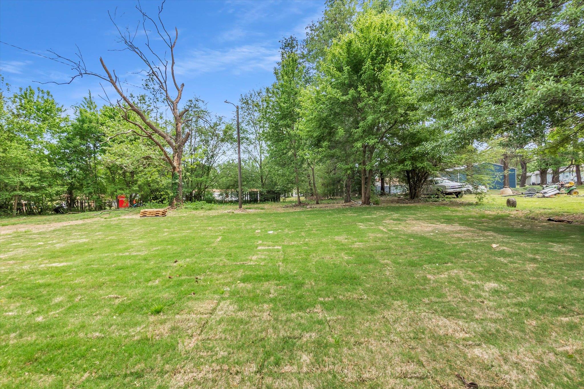 129 Tatlock Circle Covington, TN 38019 - Photo 16 of 16 View of green lawn featuring view of scattered trees