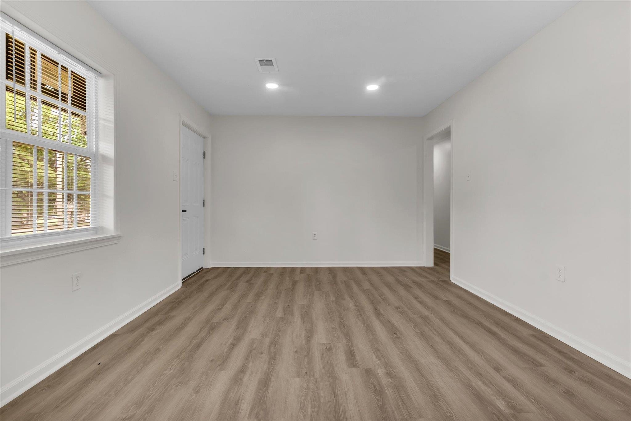 129 Tatlock Circle Covington, TN 38019 - Photo 4 of 16 Unfurnished room featuring light wood-type flooring and recessed lighting