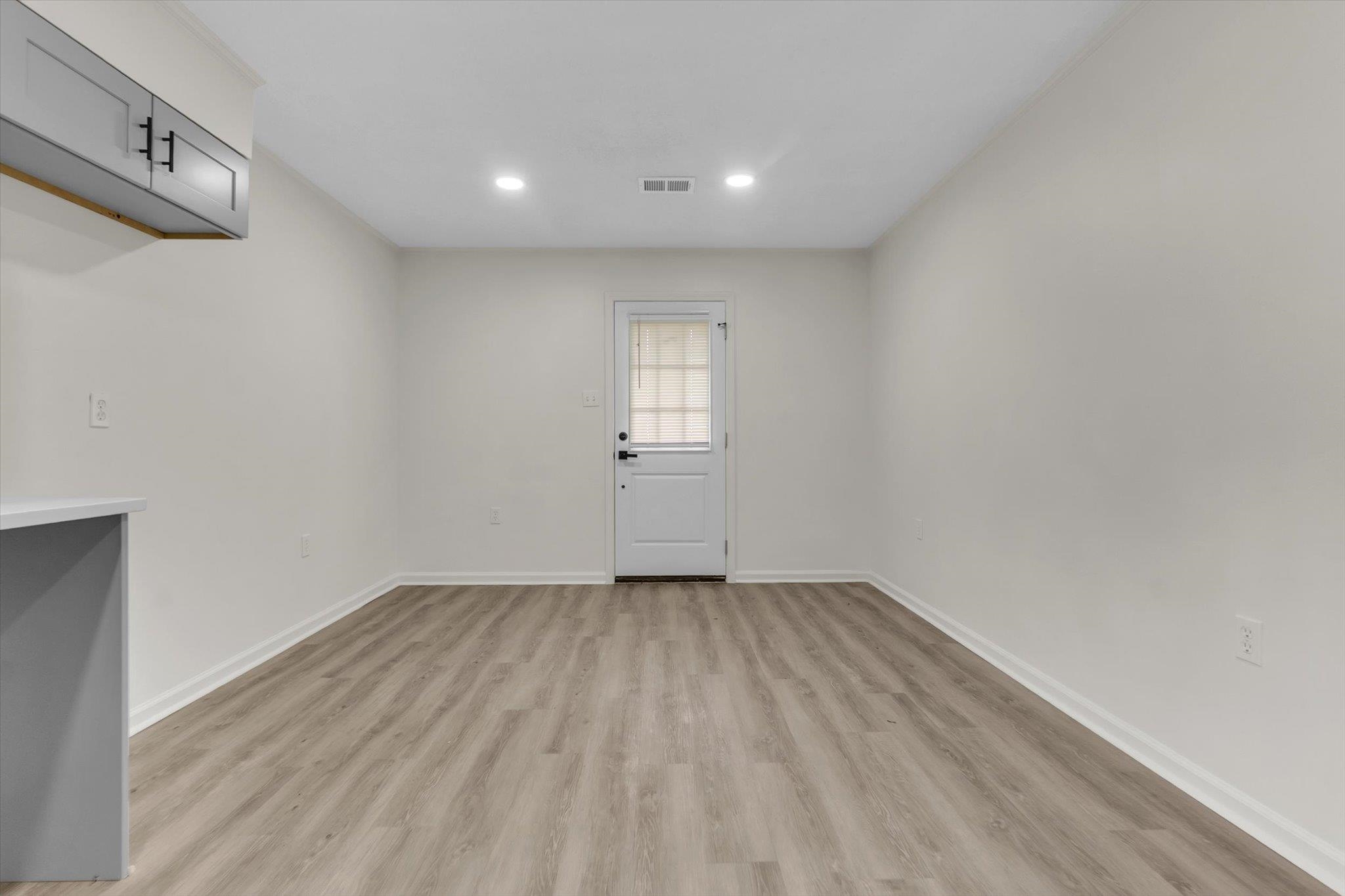 129 Tatlock Circle Covington, TN 38019 - Photo 7 of 16 Unfurnished room with light wood finished floors and recessed lighting