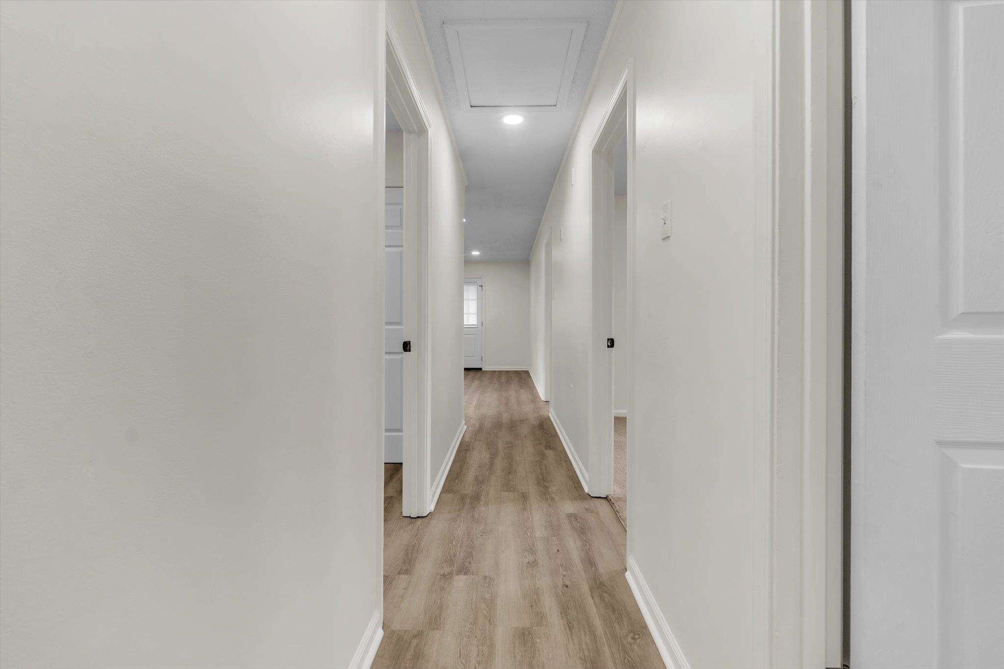 129 Tatlock Circle Covington, TN 38019 - Photo 8 of 16 Hall with light wood-style flooring and recessed lighting