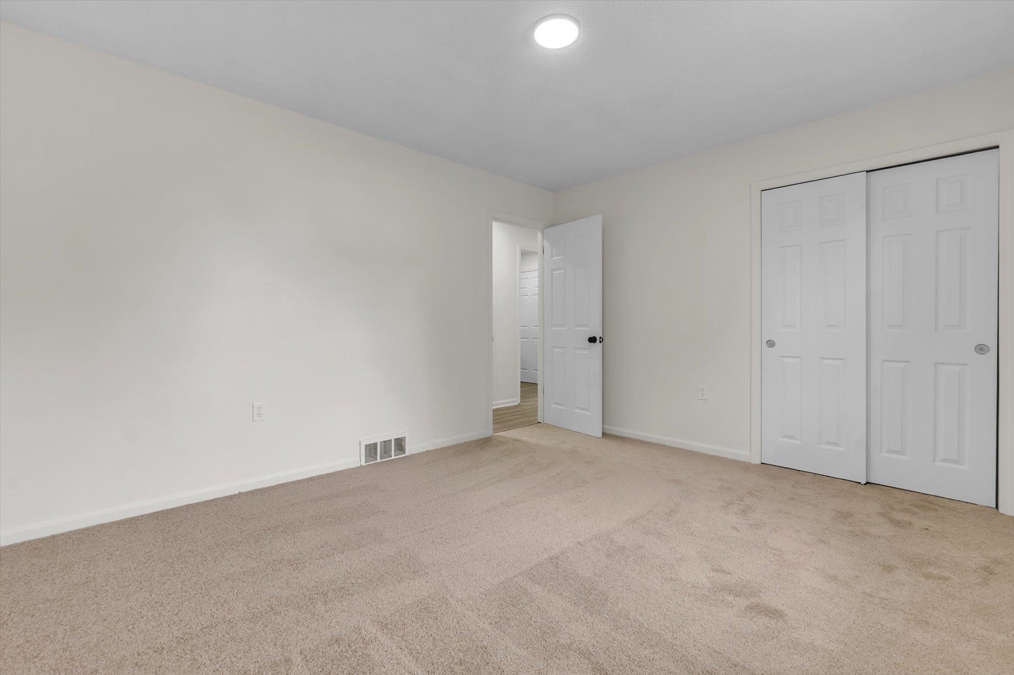 129 Tatlock Circle Covington, TN 38019 - Photo 10 of 16 Unfurnished bedroom featuring carpet flooring and a closet