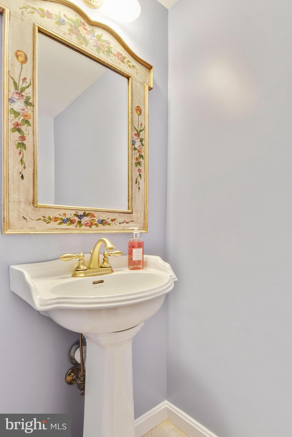 10611 Margate Road Silver Spring, MD 20901 - Photo 11 of 30 a bathroom with a sink and a mirror