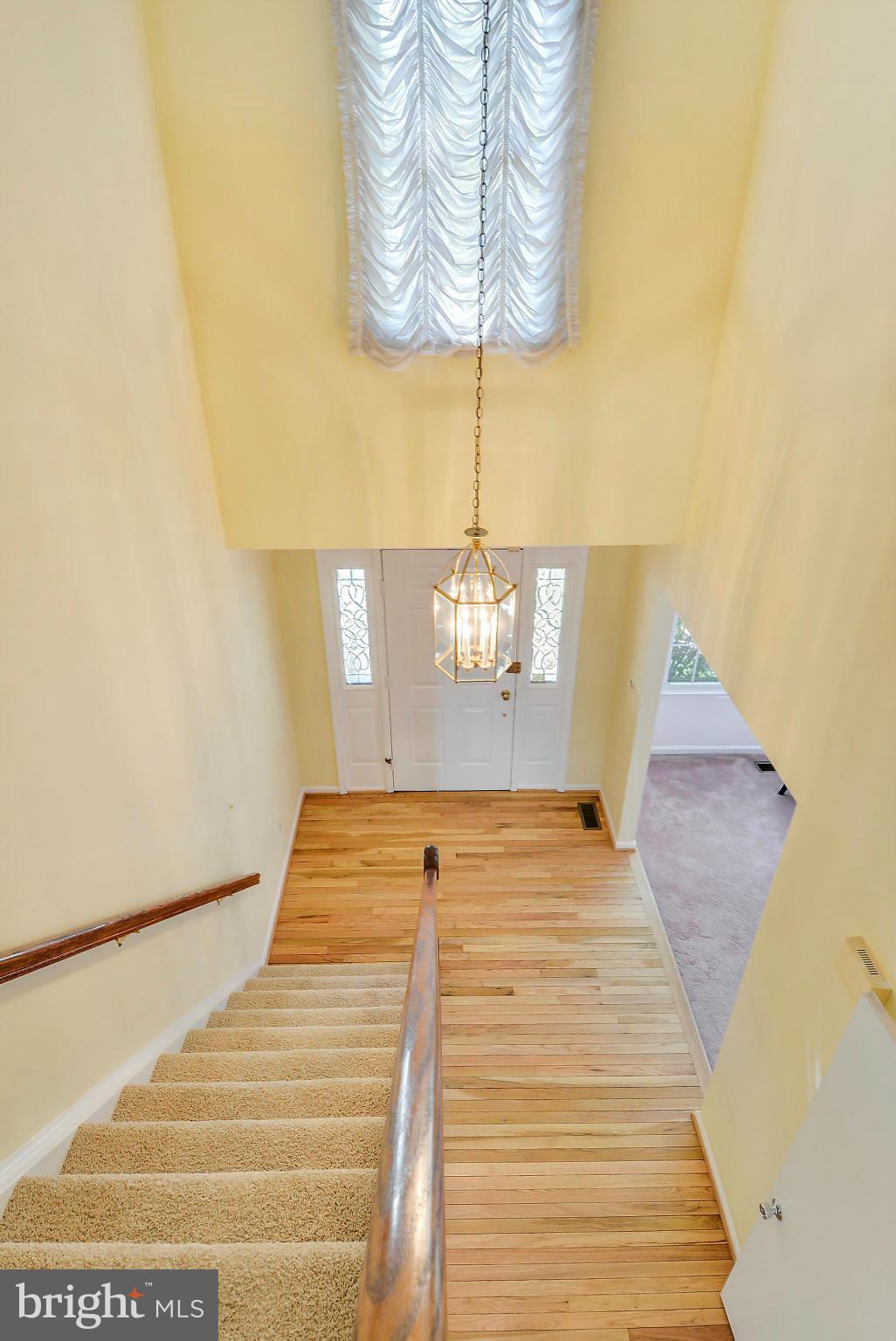 10611 Margate Road Silver Spring, MD 20901 - Photo 12 of 30 a bedroom with a bed and a chandelier