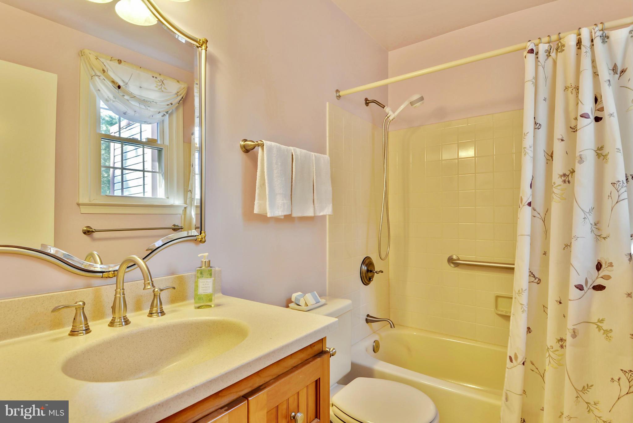 10611 Margate Road Silver Spring, MD 20901 - Photo 20 of 30 a bathroom with a sink toilet tub and shower