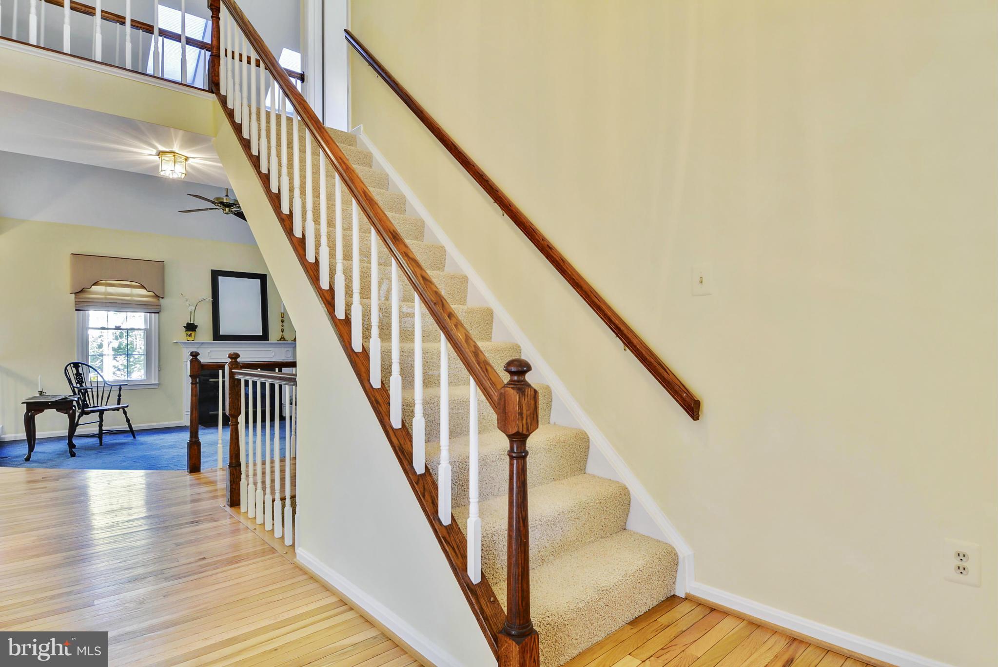 10611 Margate Road Silver Spring, MD 20901 - Photo 3 of 30 a view of staircase with lots of frames on wall and wooden floor