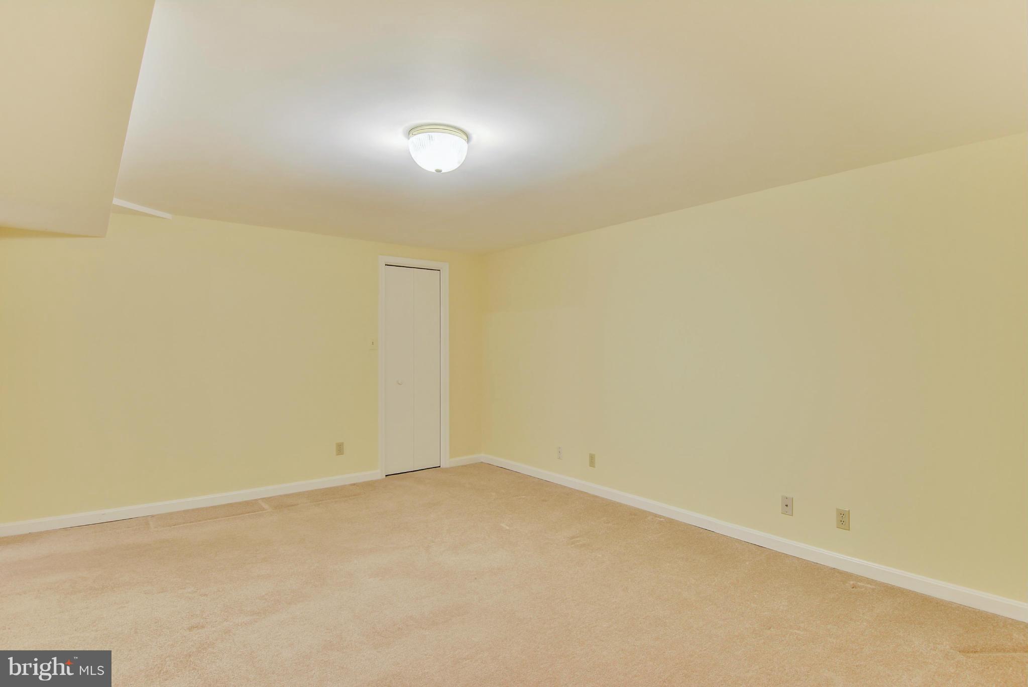 10611 Margate Road Silver Spring, MD 20901 - Photo 22 of 30 an empty room with a bench