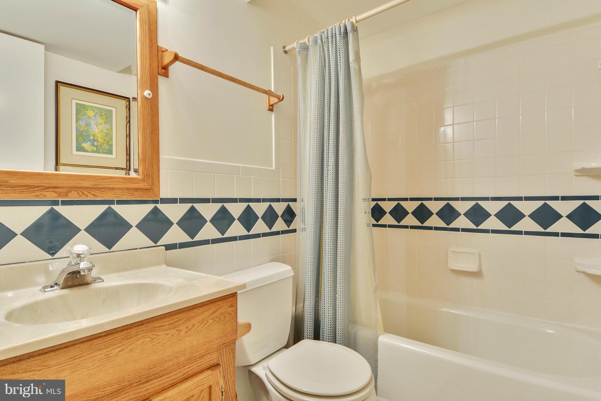 10611 Margate Road Silver Spring, MD 20901 - Photo 24 of 30 a bathroom with a sink and a mirror