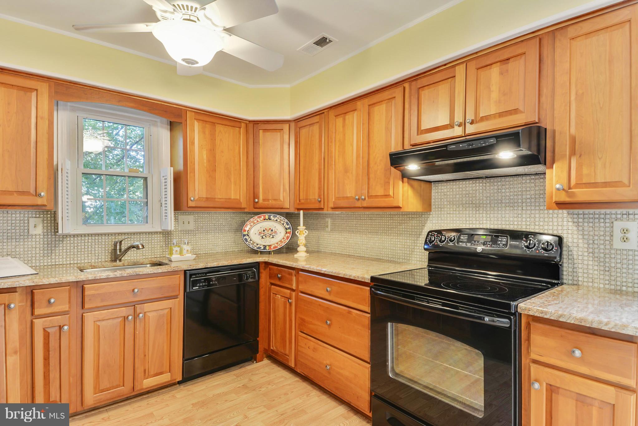 10611 Margate Road Silver Spring, MD 20901 - Photo 6 of 30 a kitchen with a stove and a sink