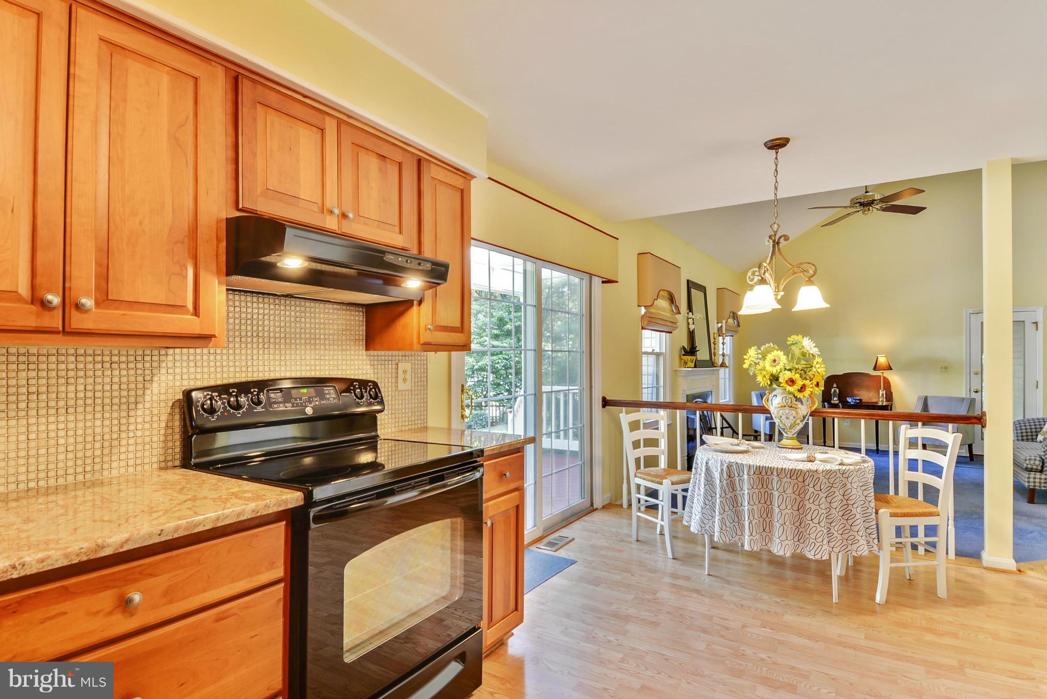 10611 Margate Road Silver Spring, MD 20901 - Photo 7 of 30 a kitchen with a stove and a refrigerator