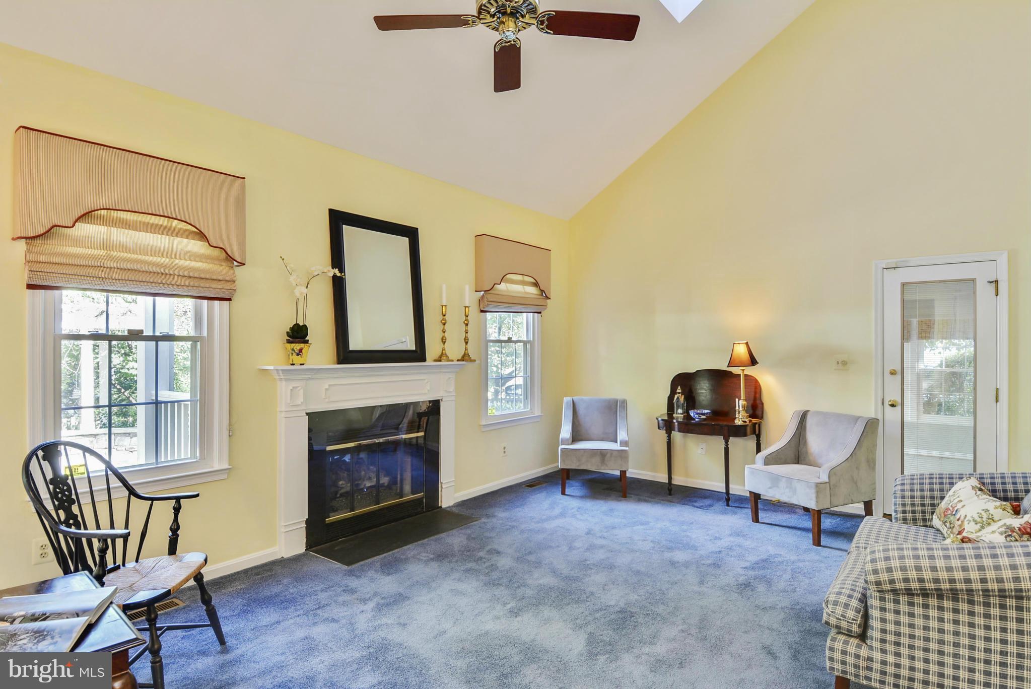 10611 Margate Road Silver Spring, MD 20901 - Photo 8 of 30 a living room with furniture and a fireplace