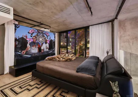 a bedroom with a bed and a window