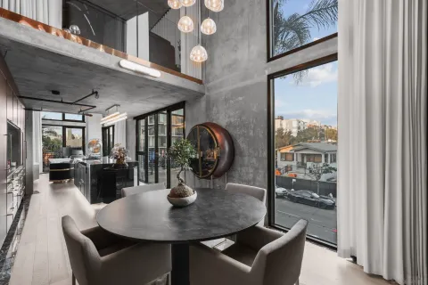 a close view of dining table with chairs
