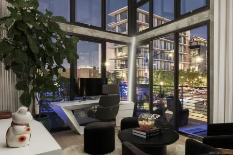 a bedroom with bed and a flat screen tv