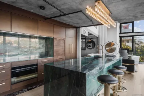 a backyard of a house with barbeque oven and a fountain