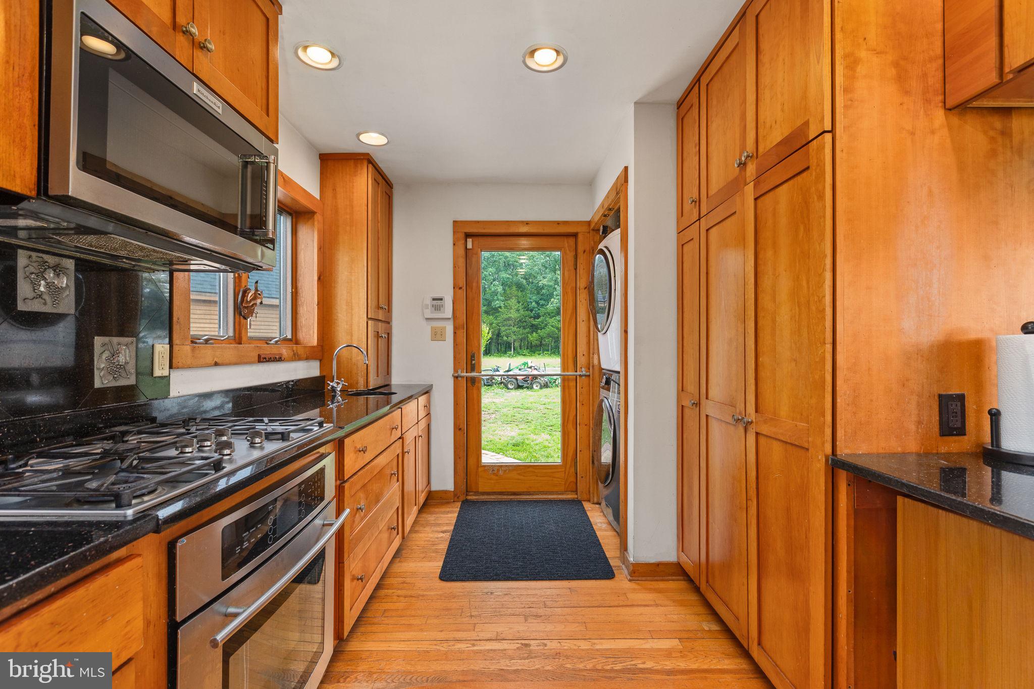 6119 Beach Road Midland, VA 22728 - Photo 36 of 98 a kitchen with stainless steel appliances granite countertop a stove and a refrigerator