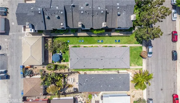an aerial view of a house with a swimming pool