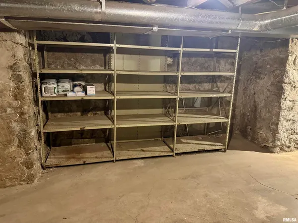 a view of an empty room with empty shelves