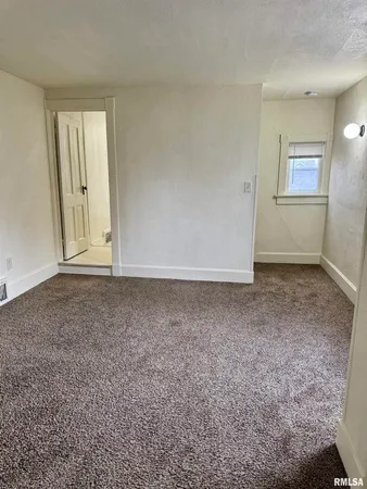 an empty room with a door