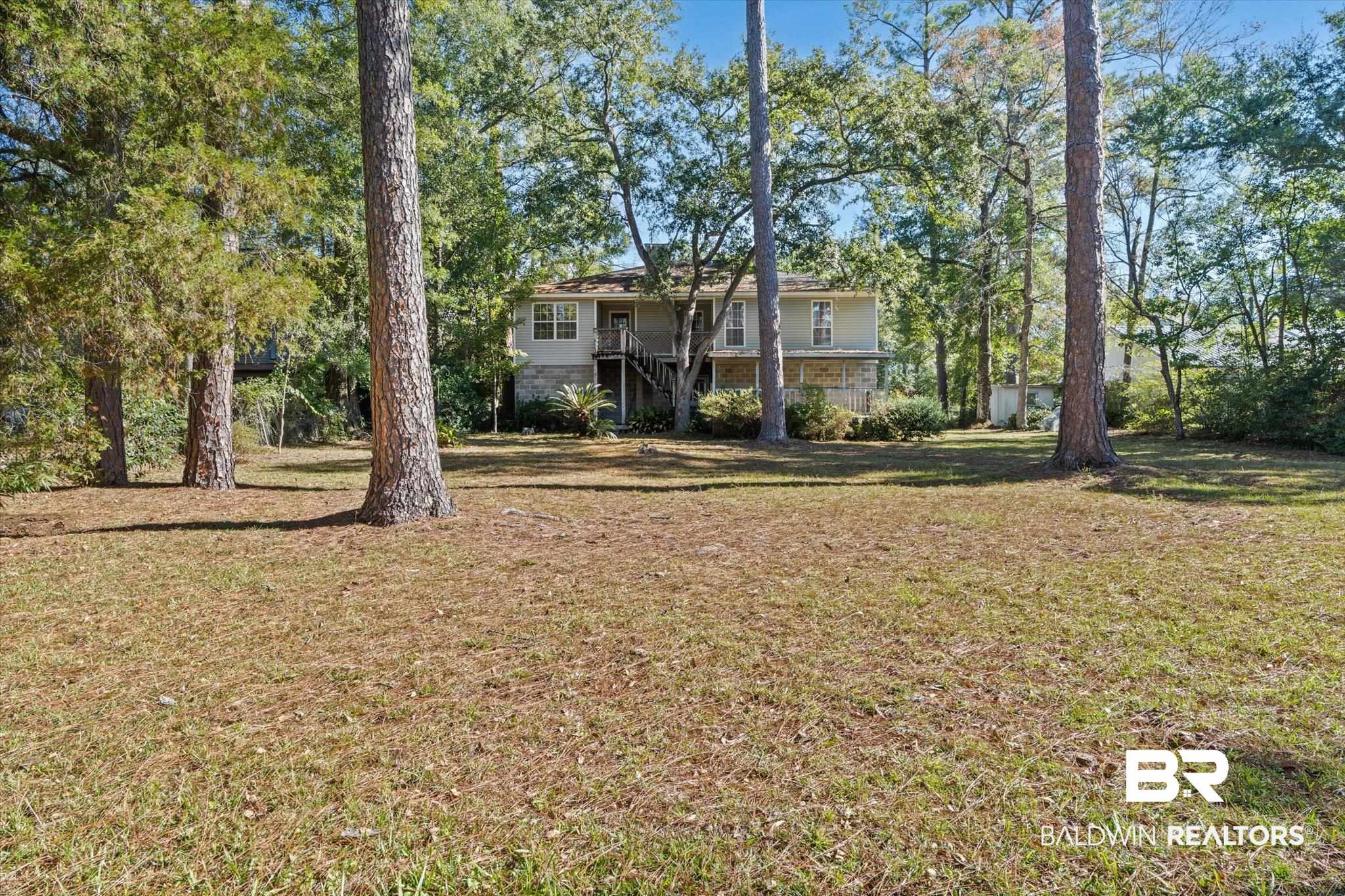 431 Simms Drive Saraland, AL 36571 - Photo 19 of 34 View of green lawn featuring stairway