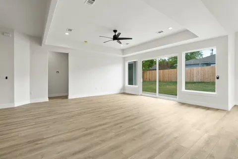 a view of an empty room with glass door
