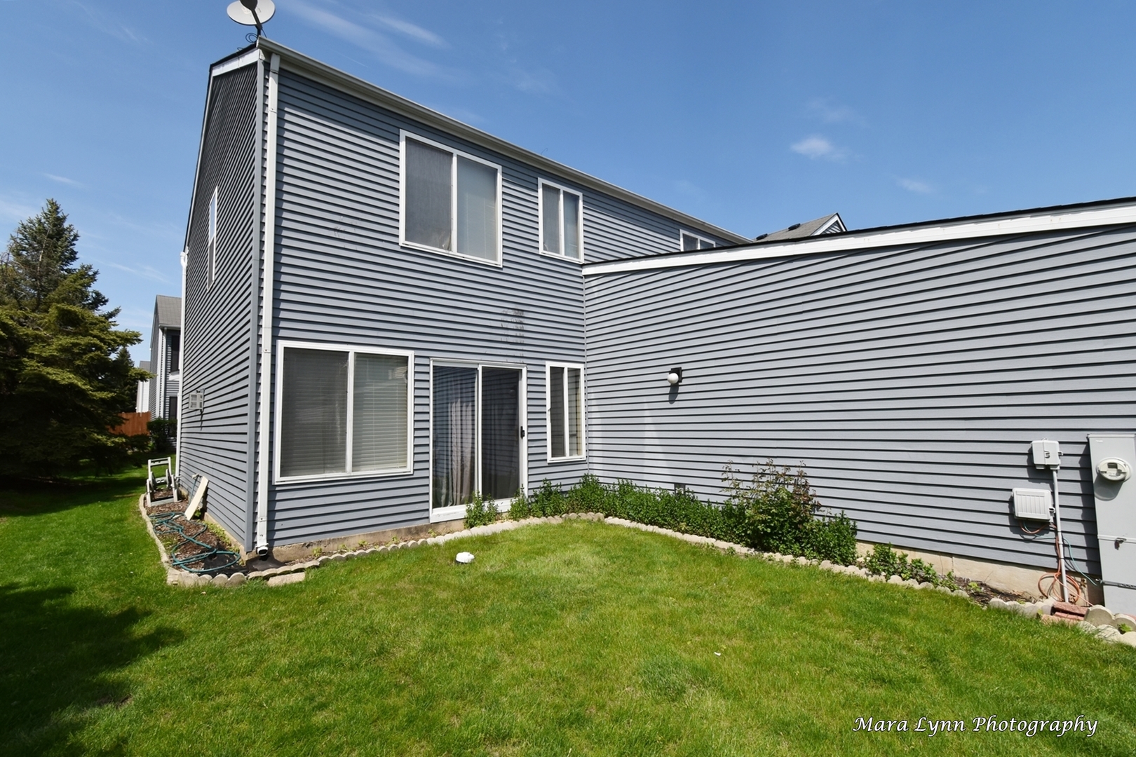 987 Symphony Drive Aurora, IL 60504 - Photo 24 of 27 a front view of a house with a yard