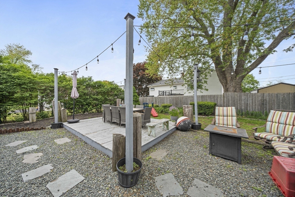 15 D Street Hull, MA 02045 - Photo 27 of 42 a view of a patio with a table chairs and a fire pit