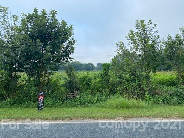 610 Bruce Thomas Road Monroe, NC 28112 - Photo 2 of 8 a view of a field with a tree
