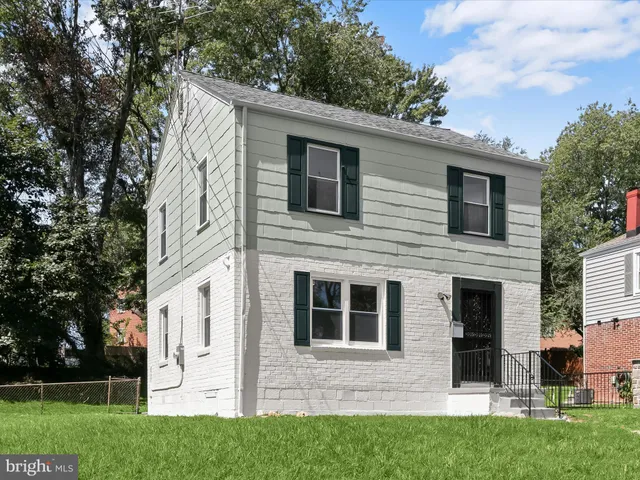 a view of house with yard