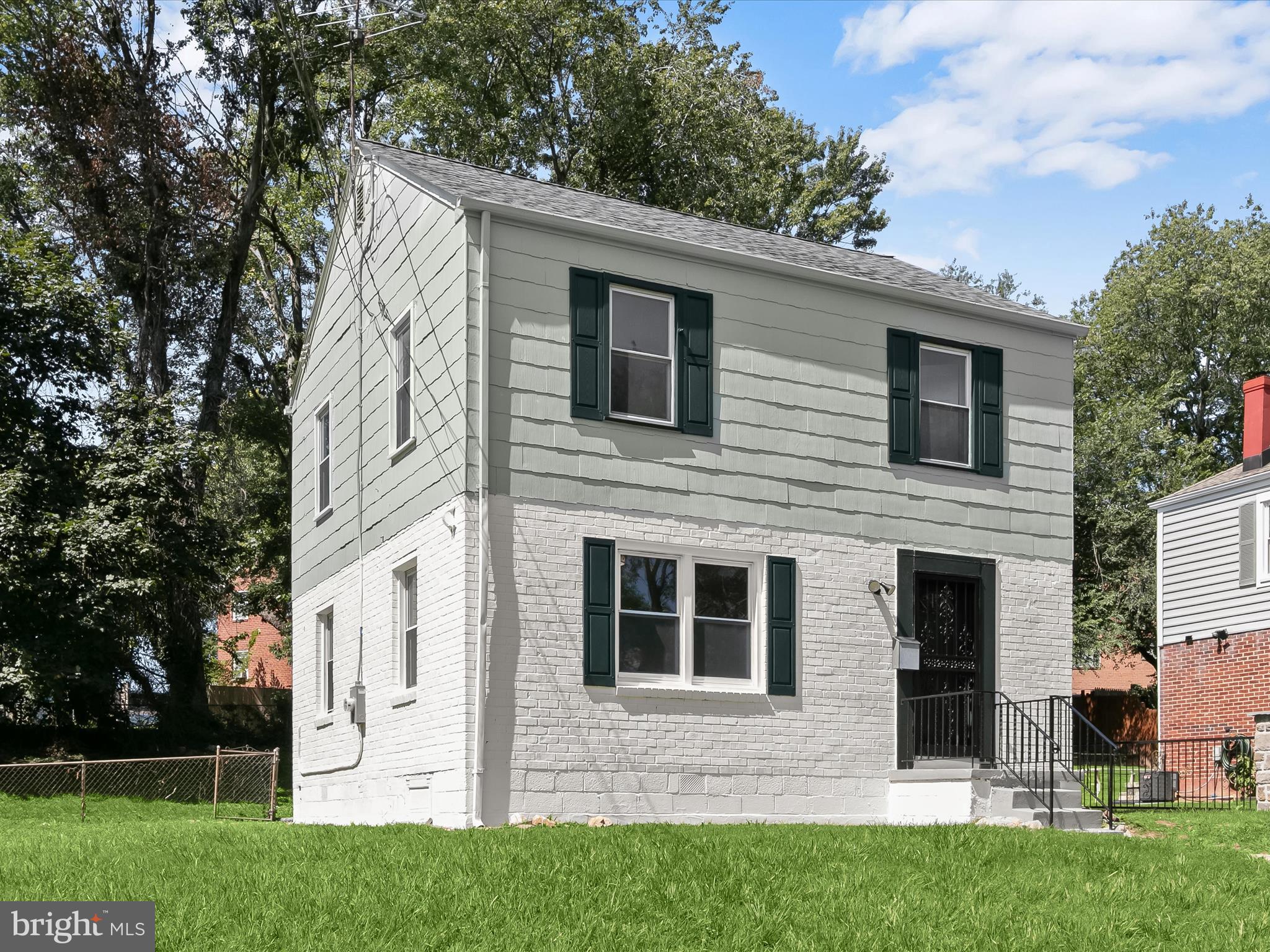 a view of house with yard