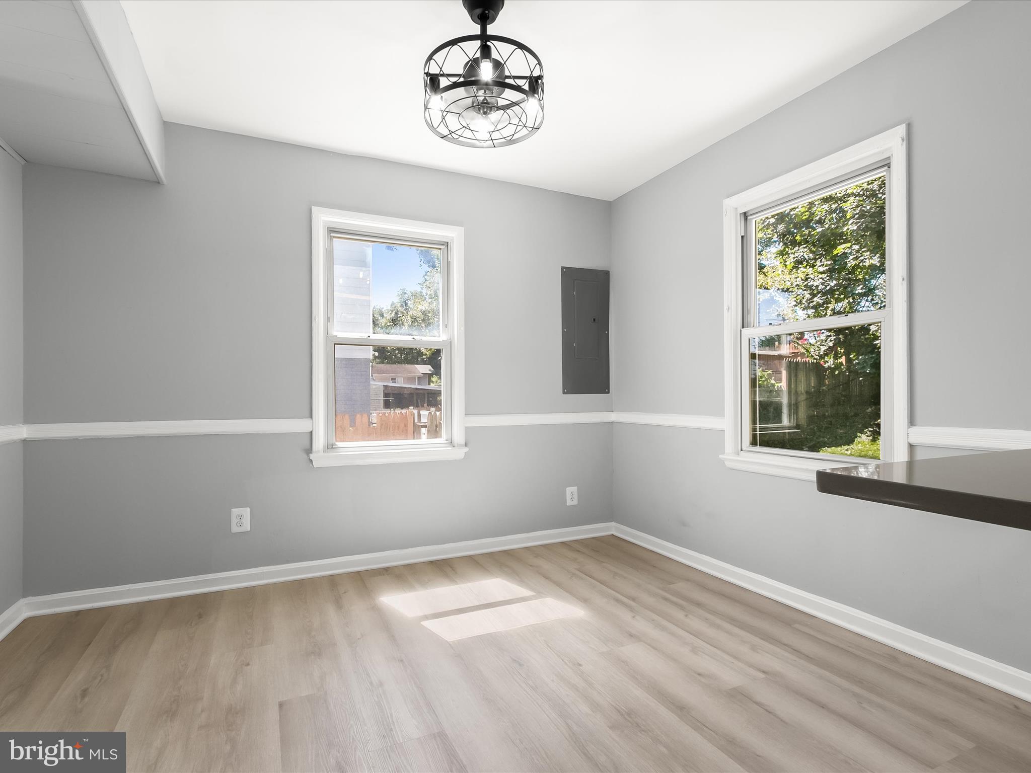6806 10th Avenue Takoma Park, MD 20912 - Photo 15 of 39 a view of a room that has a window and wooden floor
