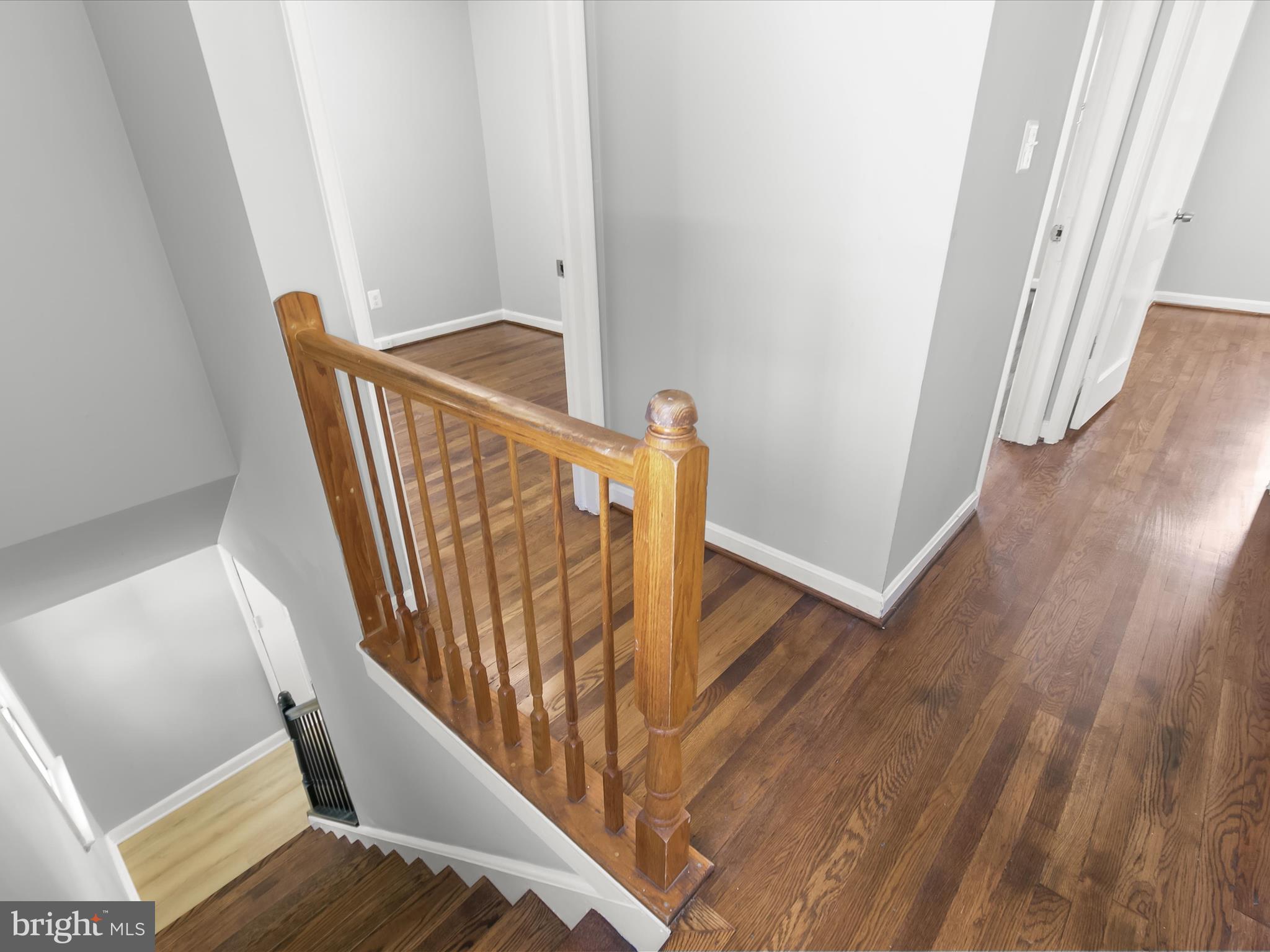 6806 10th Avenue Takoma Park, MD 20912 - Photo 20 of 39 a view of stairs and an entryway with wooden floor