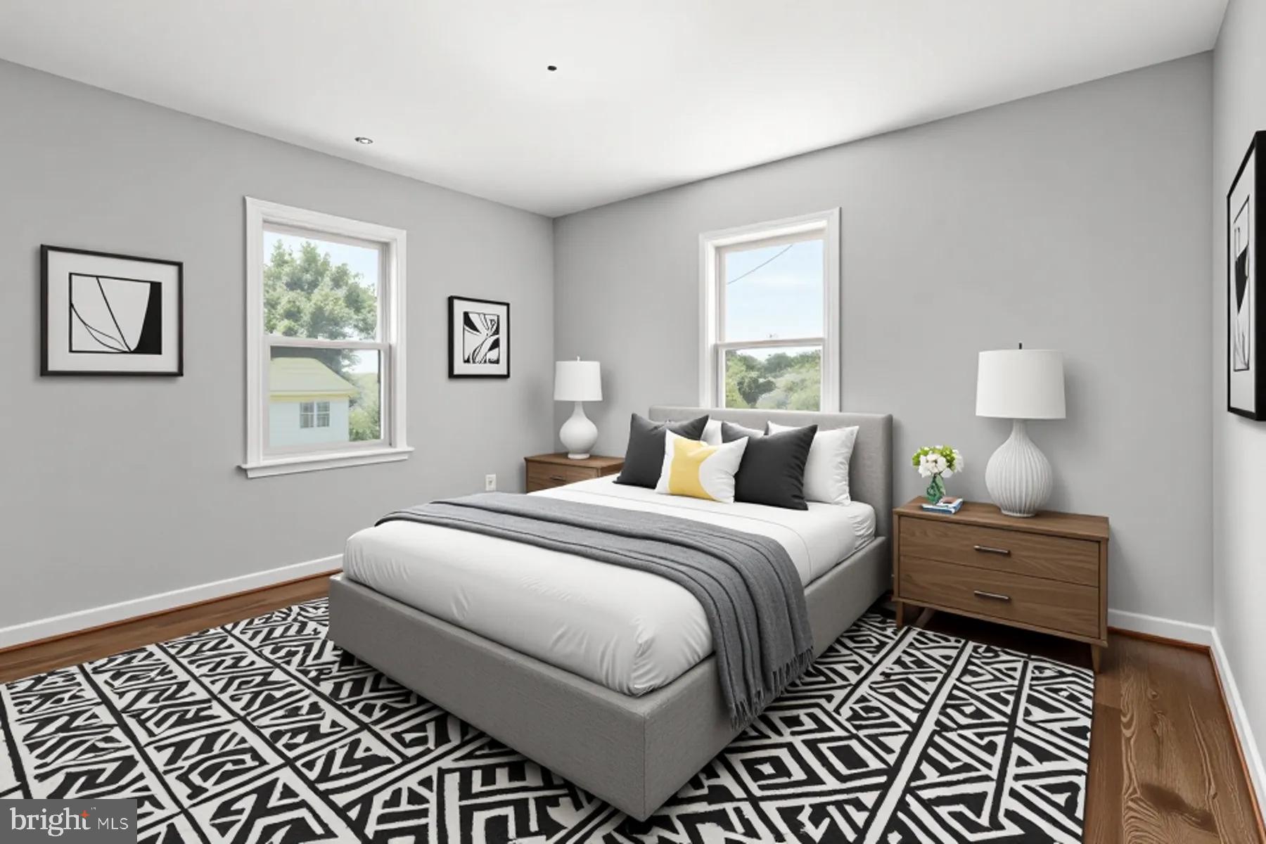 6806 10th Avenue Takoma Park, MD 20912 - Photo 22 of 39 a bedroom with a bed and a window