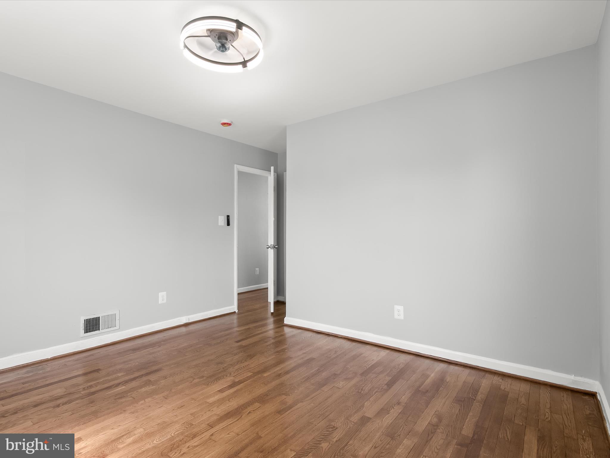 6806 10th Avenue Takoma Park, MD 20912 - Photo 26 of 39 a view of a room with wooden floor