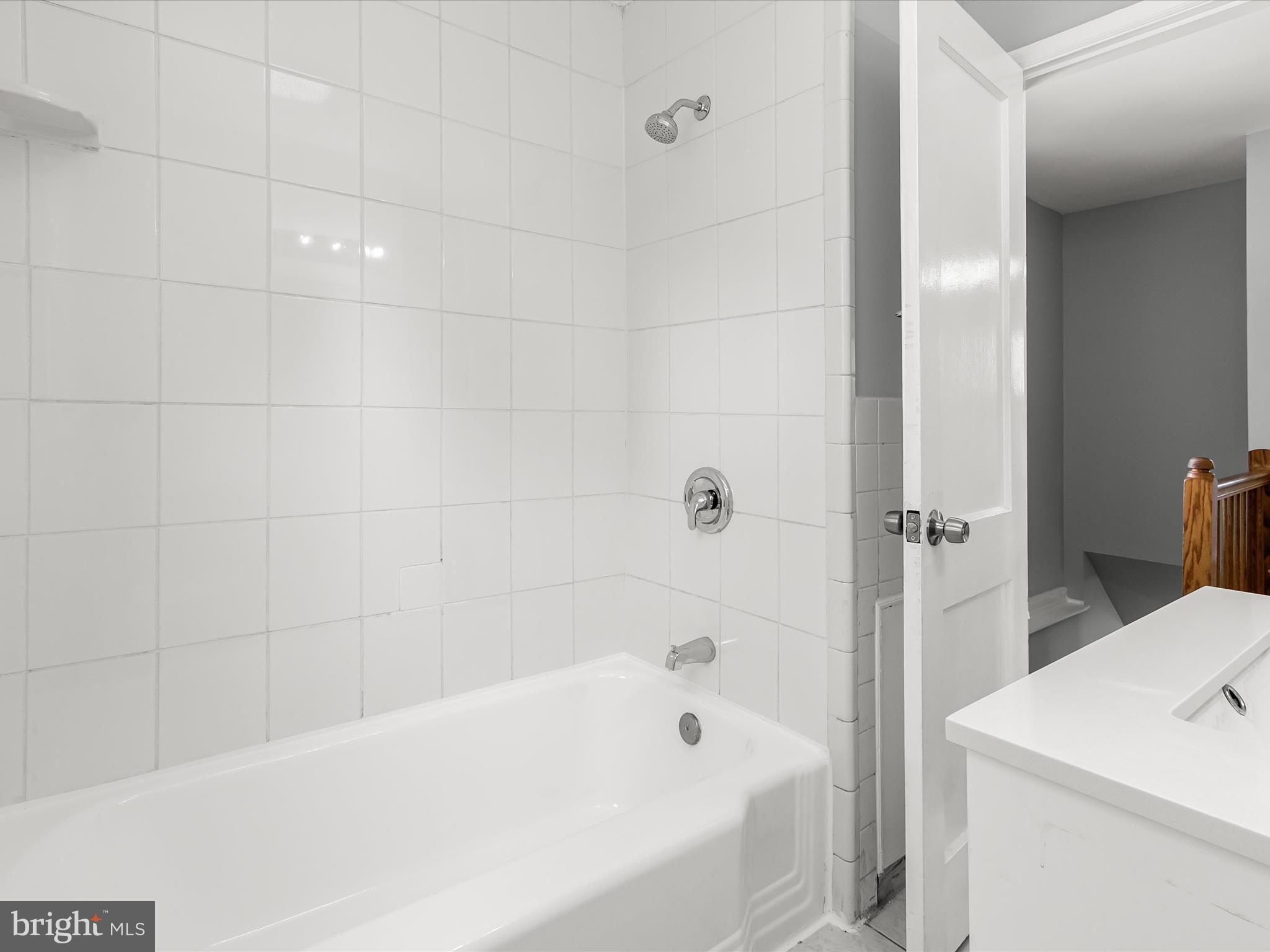 6806 10th Avenue Takoma Park, MD 20912 - Photo 28 of 39 a bathroom with a bathtub and a toilet