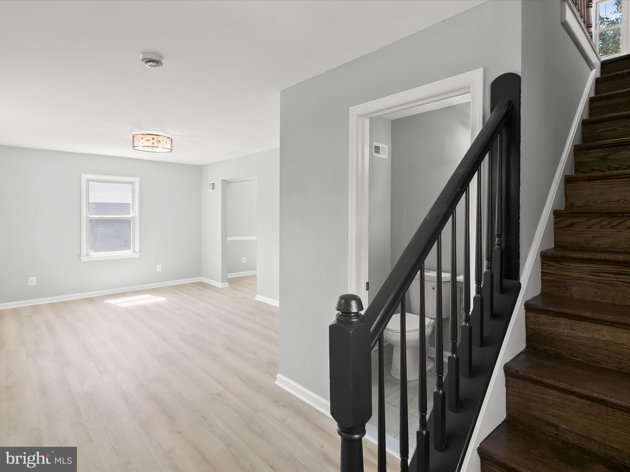 6806 10th Avenue Takoma Park, MD 20912 - Photo 4 of 39 a view of an entryway with wooden floor and stairs
