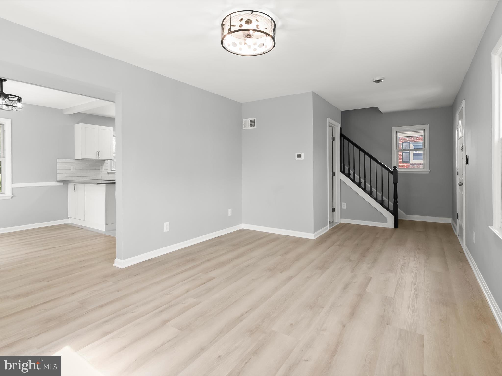 6806 10th Avenue Takoma Park, MD 20912 - Photo 8 of 39 a view of empty room with wooden floor