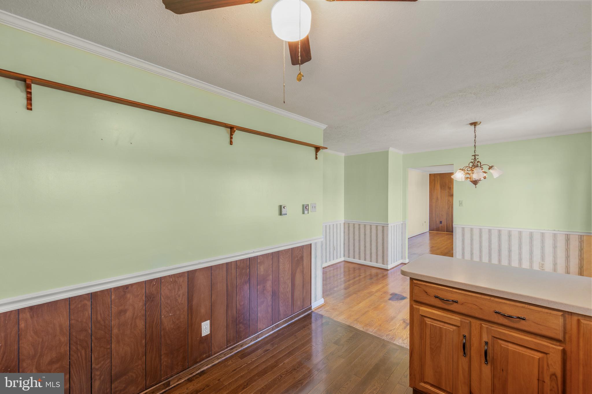 204 Ridge Road Winchester, VA 22602 - Photo 13 of 51 a kitchen with wooden floors and white walls