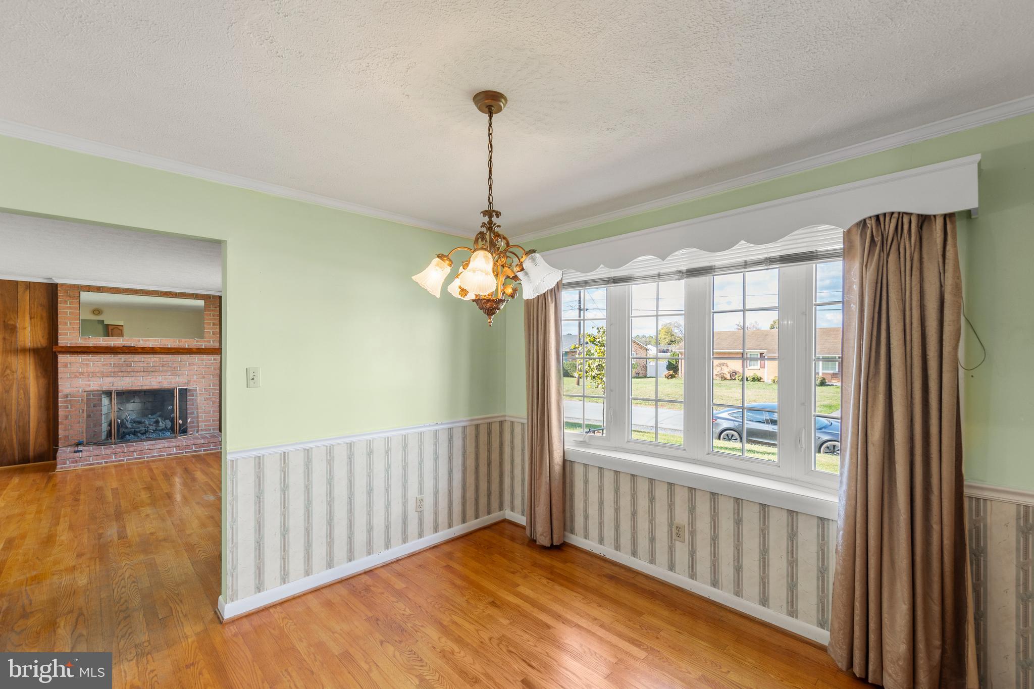 204 Ridge Road Winchester, VA 22602 - Photo 14 of 51 a view of a room with wooden floor chandelier and windows