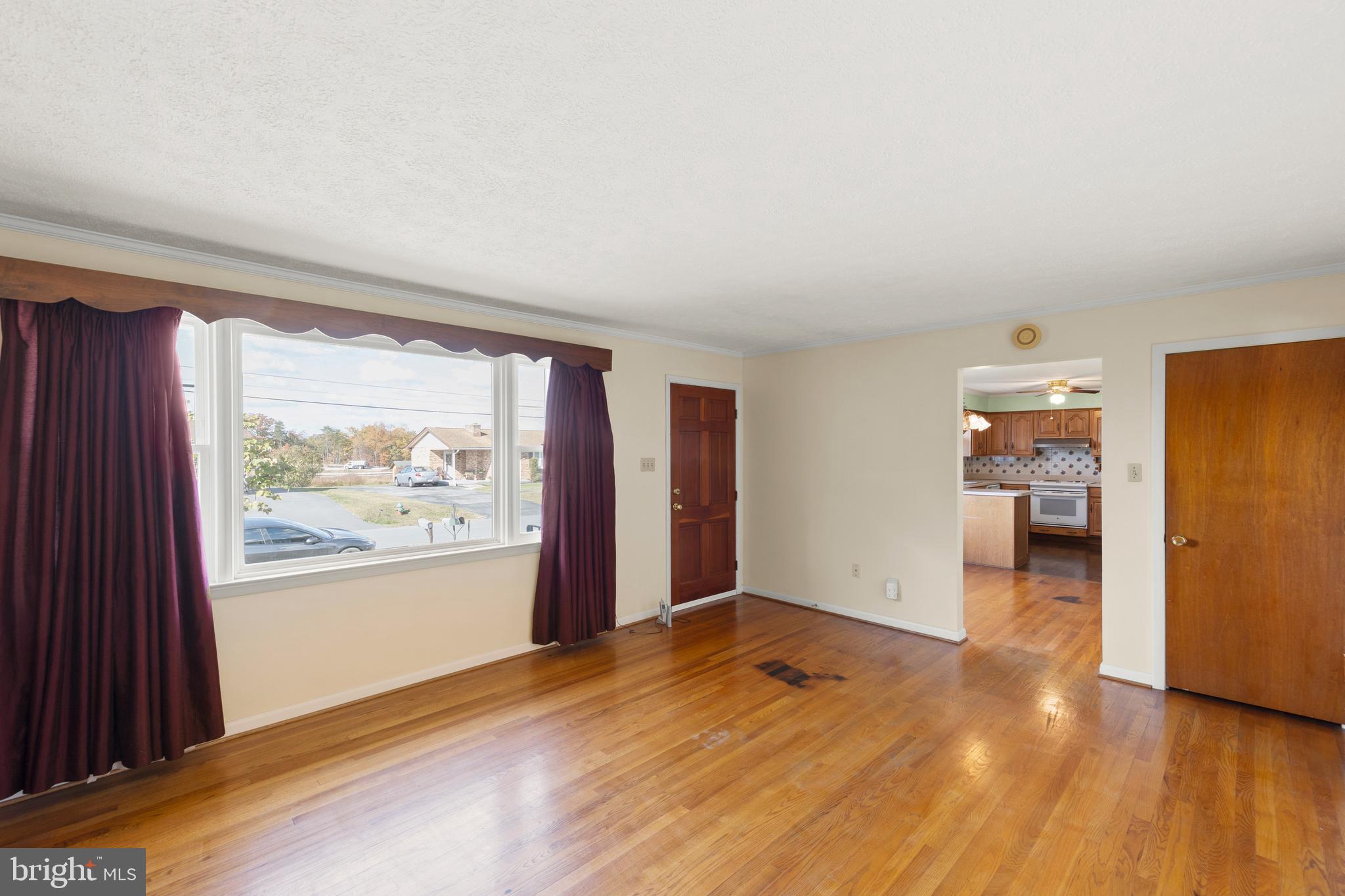 204 Ridge Road Winchester, VA 22602 - Photo 15 of 51 an empty room with wooden floor and windows