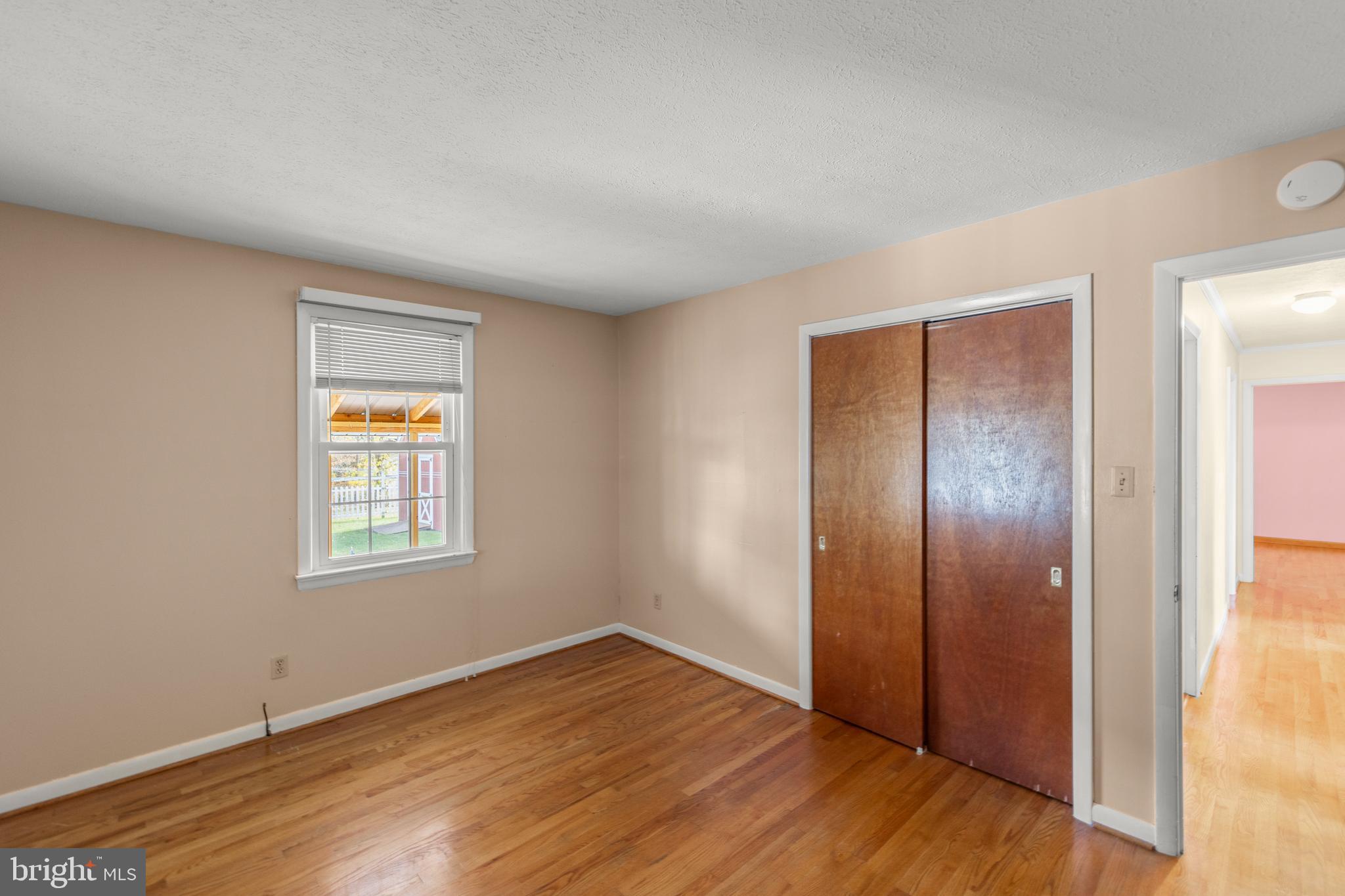 204 Ridge Road Winchester, VA 22602 - Photo 19 of 51 an empty room with wooden floor and windows