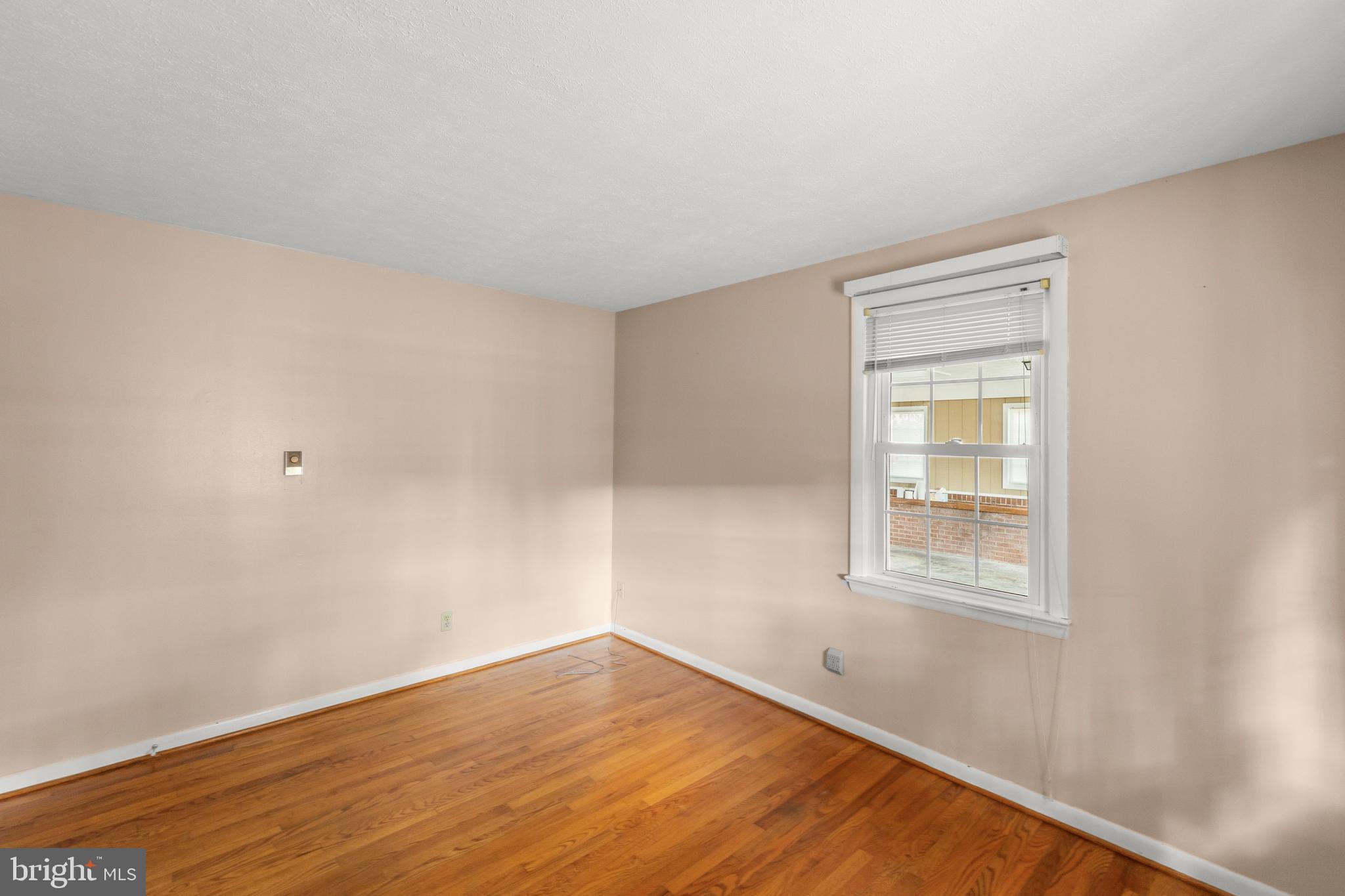 204 Ridge Road Winchester, VA 22602 - Photo 20 of 51 an empty room with wooden floor and windows
