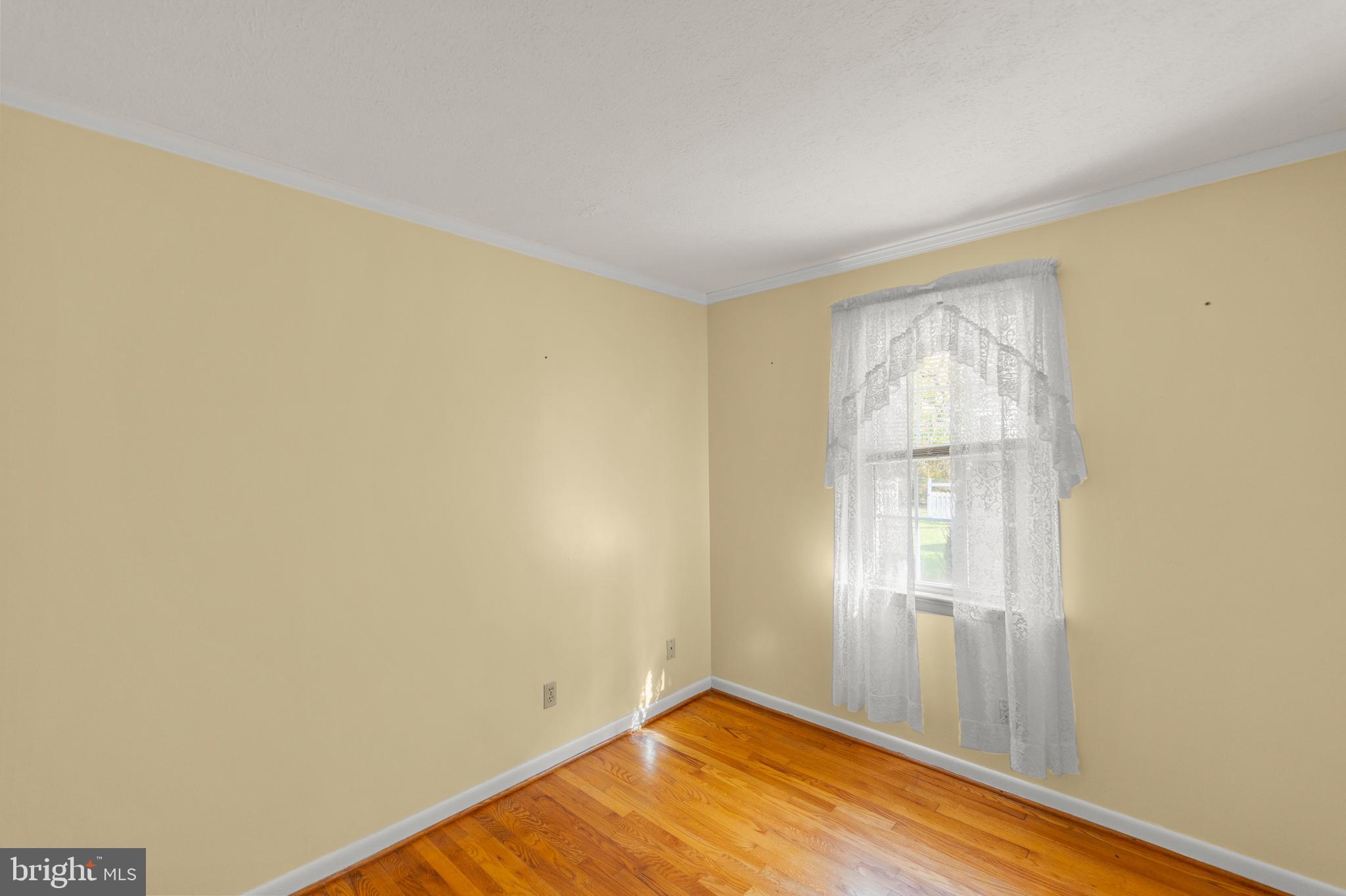 204 Ridge Road Winchester, VA 22602 - Photo 22 of 51 a view of empty room with wooden floor and fan