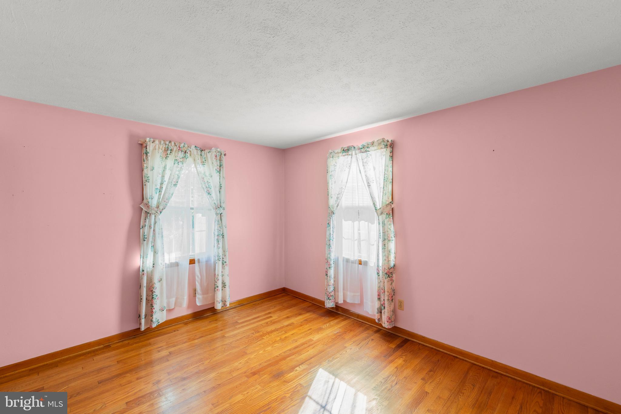 204 Ridge Road Winchester, VA 22602 - Photo 25 of 51 an empty room with wooden floor and windows